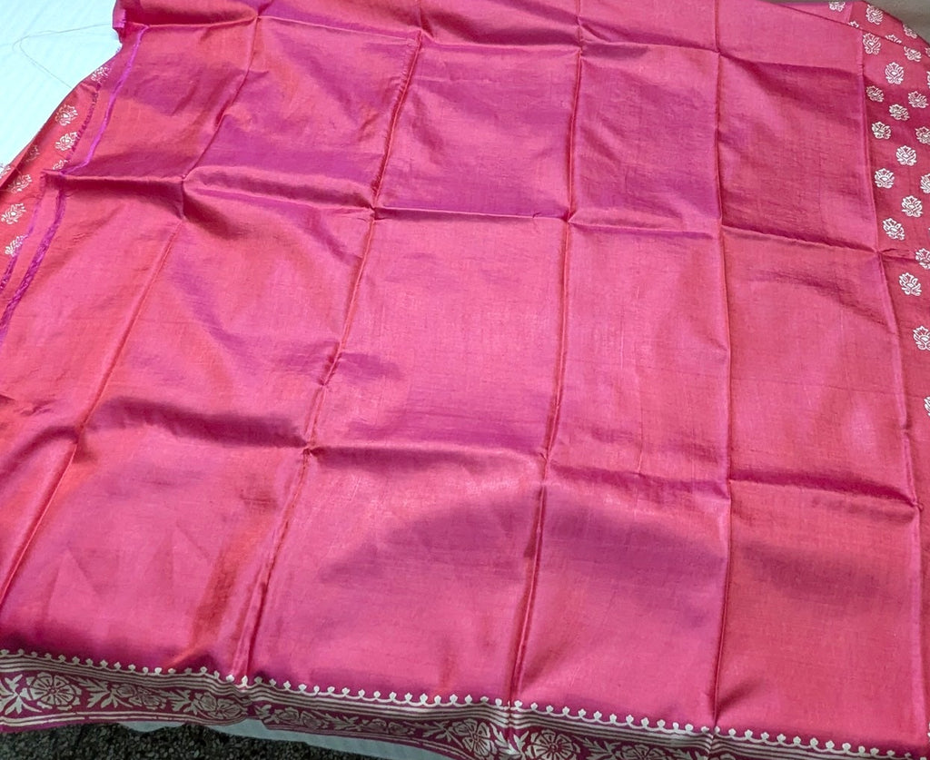 Pink pure katan silk saree blouse piece with white patterns on its border.