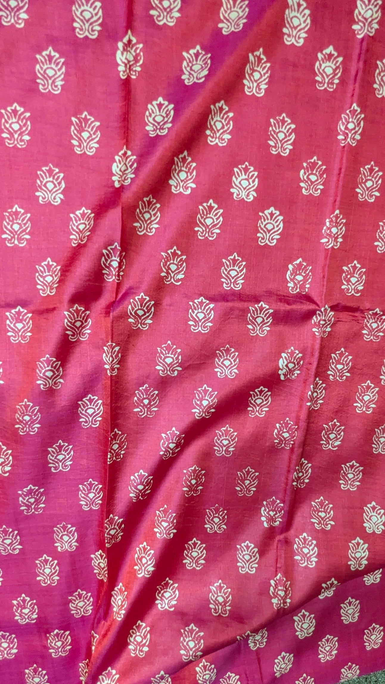 Pink pure katan silk saree with white floral patterns, body close-up 
