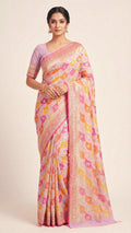 A woman wearing light lavender pure georgette silk saree.