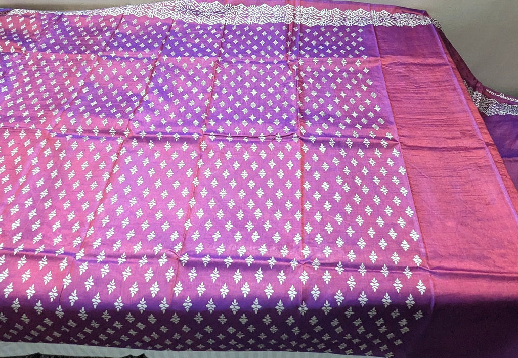 Body of Purple Katan Silk, with clear images of white motifs, with running blouse piece.