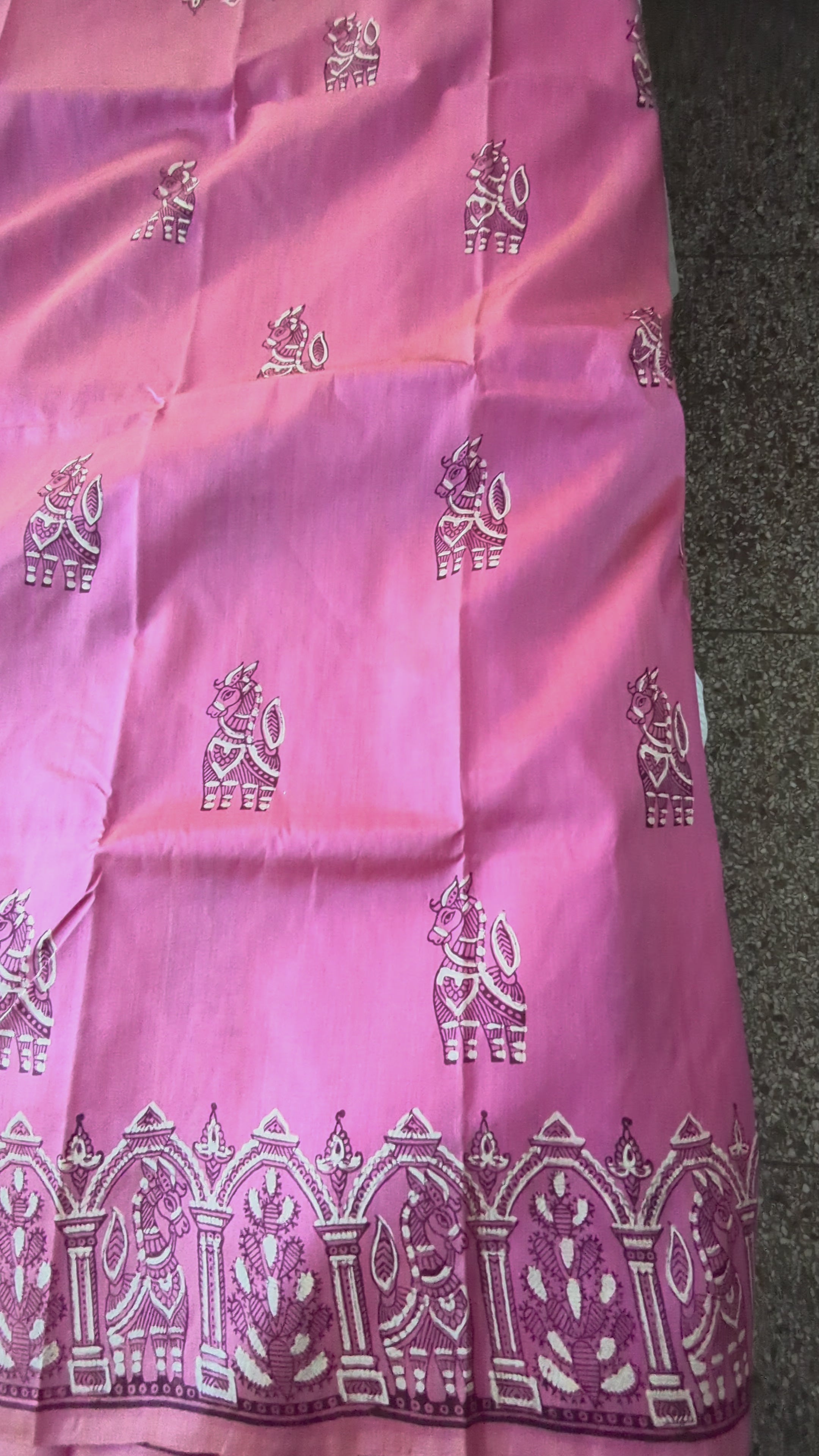 Video of a Bishnupuri pink katan silk saree, in natural light.