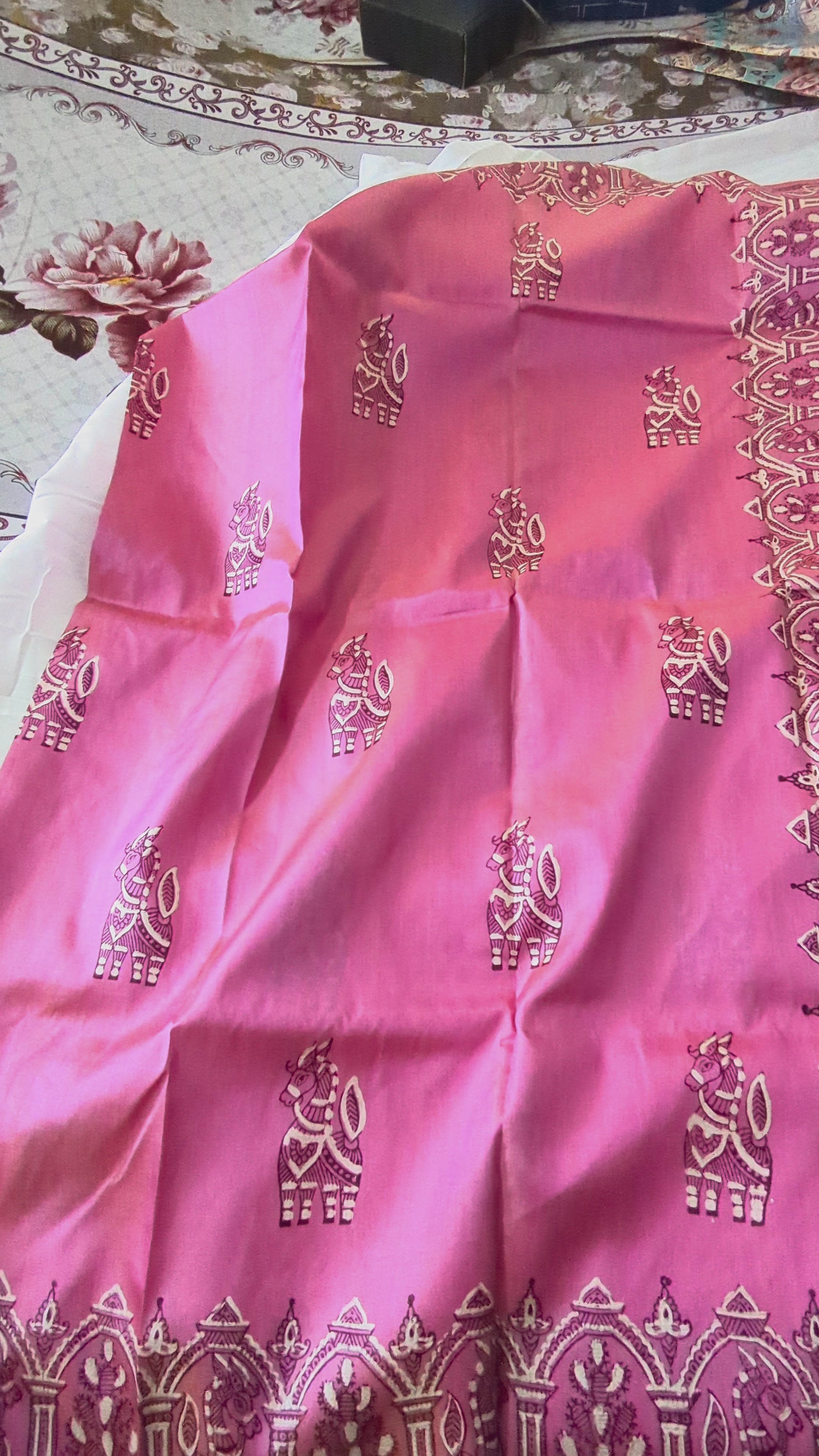 Video of a pink katan silk Bishnupuri saree. 